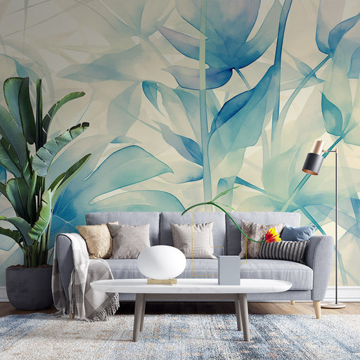 Un salon moderne avec un papier peint aux motifs de feuilles aquatiques dans des teintes de bleu, créant une ambiance apaisante et fraîche.