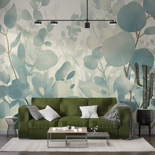 Un salon contemporain avec un papier peint aux motifs de feuillage aquarelle dans des teintes douces de bleu et vert, créant une atmosphère apaisante et naturelle.