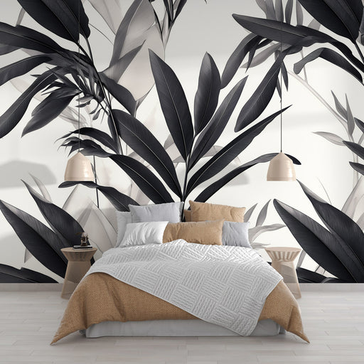 Une chambre moderne avec un papier peint monochrome représentant de grandes feuilles noires et grises, créant une atmosphère élégante et apaisante.