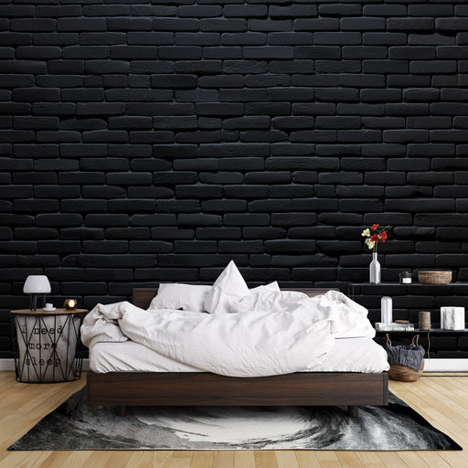 Une chambre moderne avec un papier peint en briques noires créant une ambiance urbaine et contemporaine, renforcée par des éléments décoratifs minimalistes.