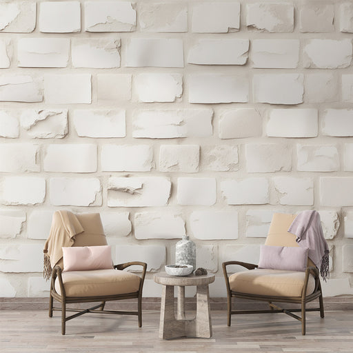 Une pièce moderne avec un papier peint imitant des briques blanches texturées, créant une ambiance chaleureuse et accueillante.