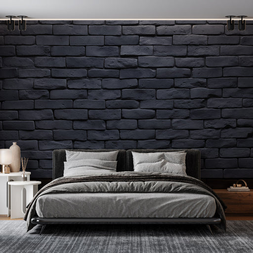 Une chambre contemporaine avec un papier peint en briques noires texturées créant une ambiance moderne et chaleureuse.