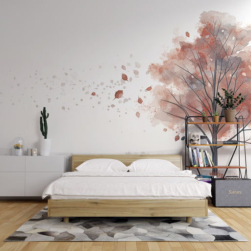 Une chambre moderne avec un papier peint aquarelle représentant un arbre aux teintes douces de rose et gris, créant une atmosphère apaisante et artistique.