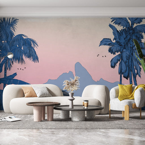 Un salon contemporain avec un papier peint représentant des palmiers et des montagnes en bleu sur fond dégradé rose, créant une ambiance tropicale et apaisante.