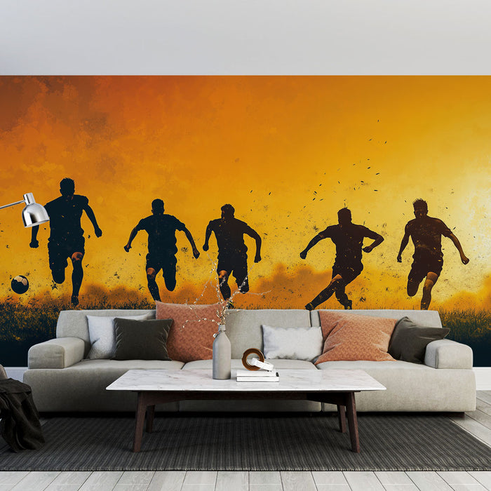 Papier peint mural sportif avec silhouettes de joueurs de football sur fond orange pour salon moderne.