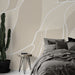 Papier peint abstrait beige avec motifs organiques et lignes fluides pour chambre moderne.