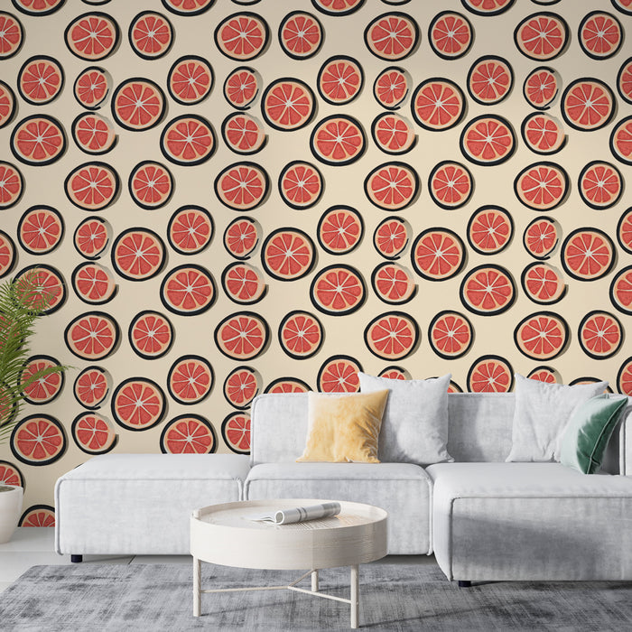 Un salon moderne avec un papier peint ludique représentant des rondelles de pamplemousse sur fond clair, créant une ambiance fraîche et joyeuse.
