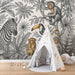 Une chambre d'enfant avec un papier peint illustré de motifs animaliers en noir et blanc, créant une ambiance ludique et naturelle.