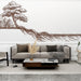 Un salon contemporain avec un papier peint illustrant un arbre stylisé aux racines étendues, créant une atmosphère naturelle et apaisante.