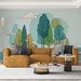 Un salon moderne avec un papier peint illustratif représentant des arbres stylisés dans des teintes vertes et bleues sur fond clair, créant une ambiance apaisante et naturelle.