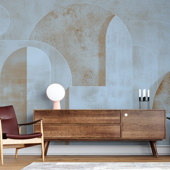 Un salon moderne avec un papier peint abstrait bleu clair et beige, aux formes géométriques douces, créant une atmosphère apaisante et contemporaine.