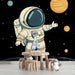 Papier peint espace avec astronaute et planètes colorées pour chambre enfant