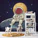 Papier peint ludique avec astronaute sur la lune pour chambre d'enfant.