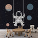 Papier peint espace avec astronaute et planètes pour chambre enfant