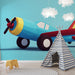 Papier peint avion coloré avec modèle d'avion graphique et ludique pour chambre d'enfant