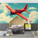 Papier peint avion rouge rétro sur fond nuageux pour chambre d'enfant.