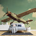Papier peint vintage avec avion classique dans un ciel bleu pour décoration de chambre adulte