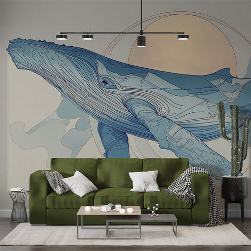 Un salon moderne avec un papier peint représentant une baleine stylisée en bleu sur fond clair, évoquant une ambiance apaisante et marine.