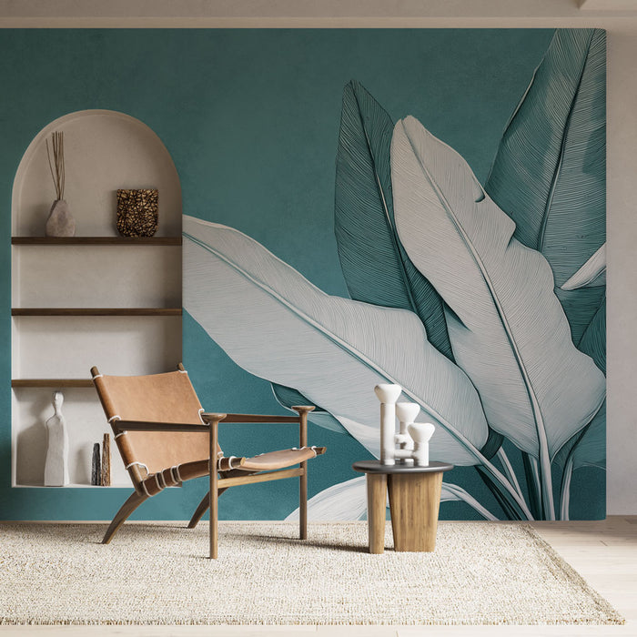 Une pièce moderne avec un papier peint tropical bleu-vert illustrant de grandes feuilles blanches, créant une ambiance apaisante et naturelle.