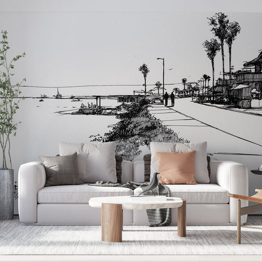Un salon moderne avec un papier peint illustratif représentant une promenade en bord de mer, évoquant une atmosphère paisible et artistique.