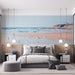 Une chambre moderne avec un papier peint représentant une scène de plage apaisante, aux teintes douces de bleu et de sable, évoquant une ambiance sereine et estivale.