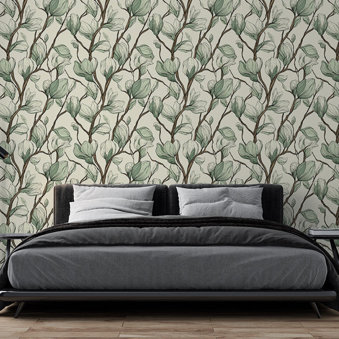 Une chambre moderne avec un papier peint floral aux motifs de feuilles délicates vertes sur fond crème, créant une ambiance apaisante et naturelle.