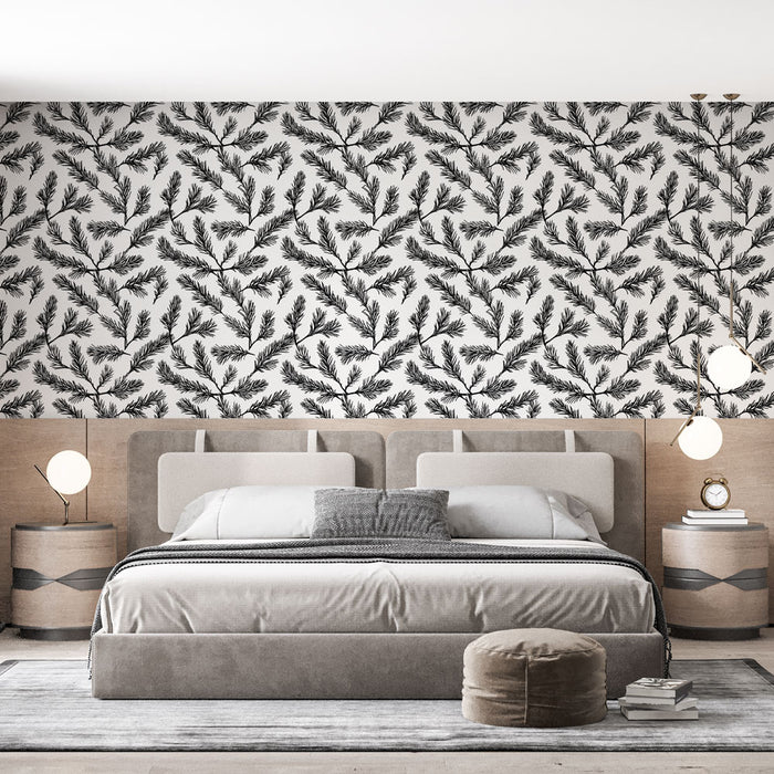Une chambre moderne avec un papier peint noir et blanc représentant des branches de conifères, créant une ambiance naturelle et apaisante.