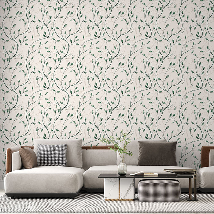 Un salon moderne avec un papier peint aux motifs de branches délicates et feuilles vertes sur fond clair, créant une ambiance naturelle et apaisante.
