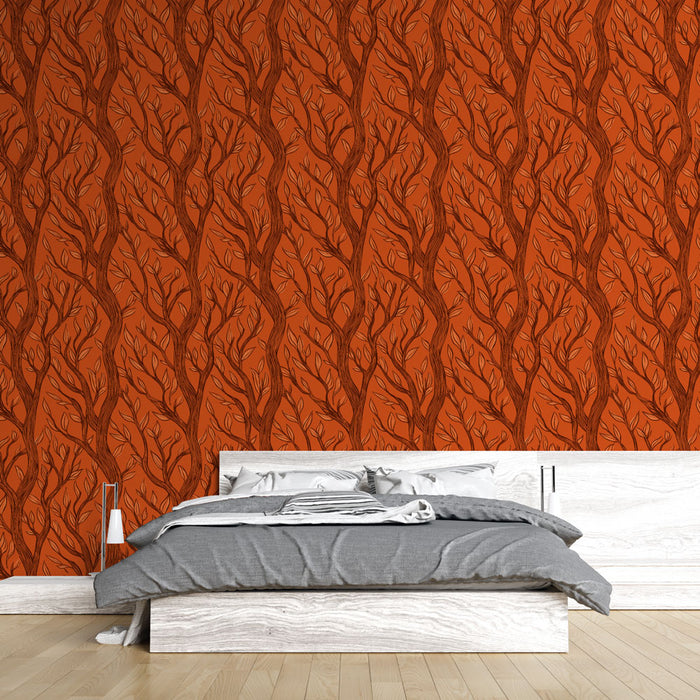 Une chambre moderne avec un papier peint terracotta orné de motifs de branches stylisées, créant une atmosphère chaleureuse et accueillante.