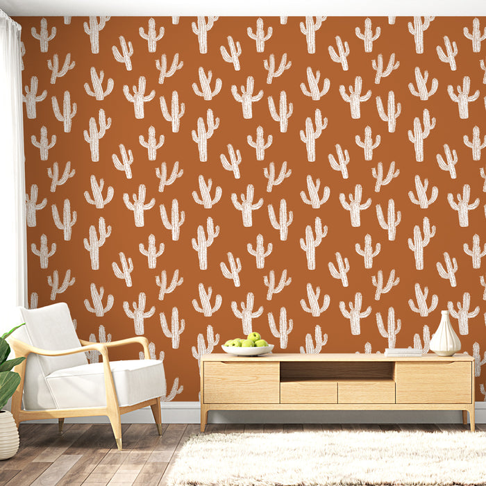 Une pièce moderne avec un papier peint terracotta orné de cactus blancs, créant une ambiance chaleureuse et accueillante.