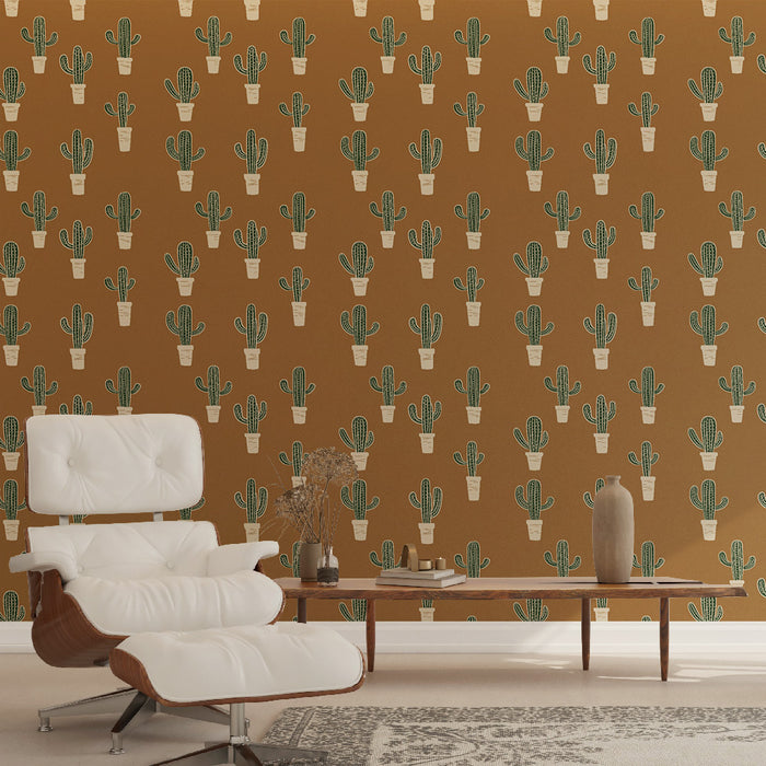 Une pièce moderne avec un papier peint terracotta orné de motifs de cactus en pots, créant une ambiance chaleureuse et accueillante.