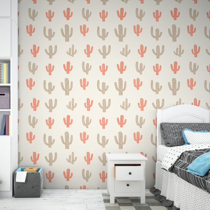 Une chambre moderne avec un papier peint illustrant des cactus en teintes beige et corail sur fond clair, créant une ambiance fraîche et ludique.