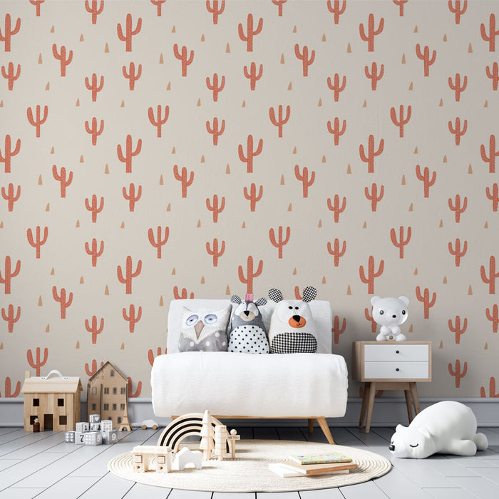 Une chambre d'enfant avec un papier peint aux motifs de cactus corail sur fond beige, créant une ambiance ludique et chaleureuse.