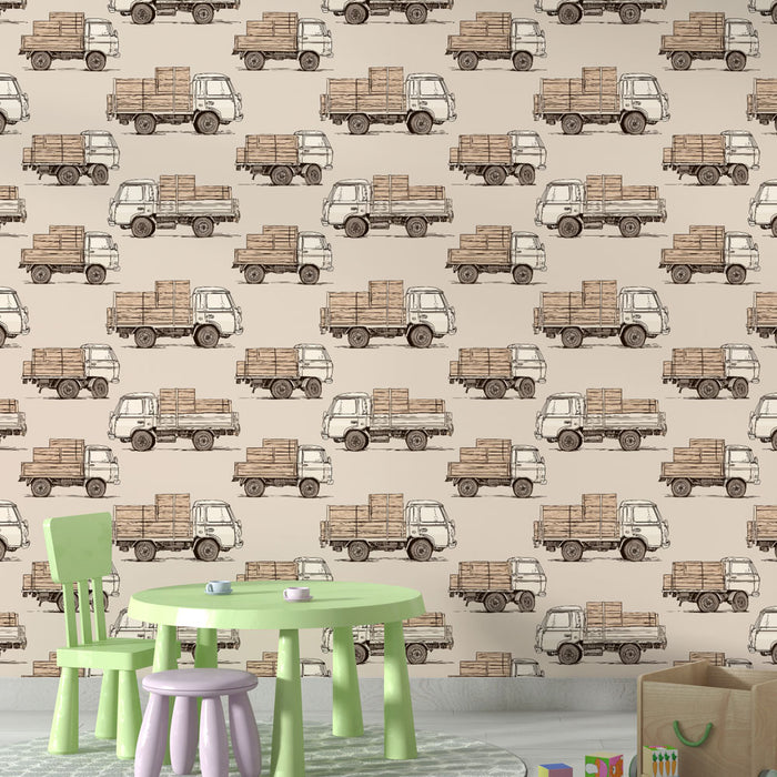 Une salle de jeu avec un papier peint illustrant des camions vintage chargés de caisses en bois sur fond beige, créant une ambiance ludique et chaleureuse.