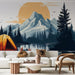 Une pièce de vie moderne avec un papier peint représentant un paysage de montagne stylisé, évoquant l'aventure et la sérénité au bord d'un lac.