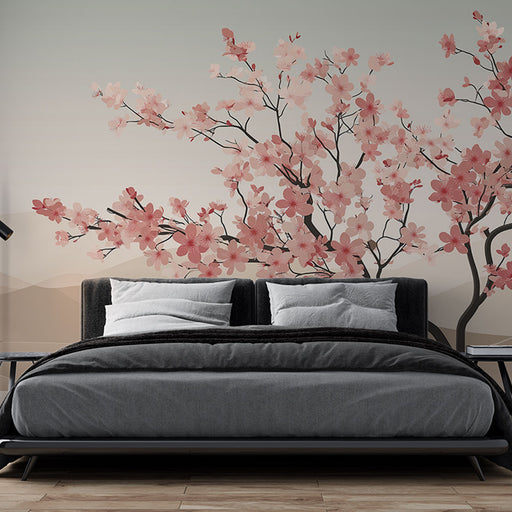 Une chambre moderne avec un papier peint floral représentant des branches de cerisier en fleurs roses sur un fond dégradé apaisant.
