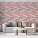 Un salon moderne avec un papier peint rose illustrant des nuages et des croissants de lune, créant une atmosphère douce et rêveuse.