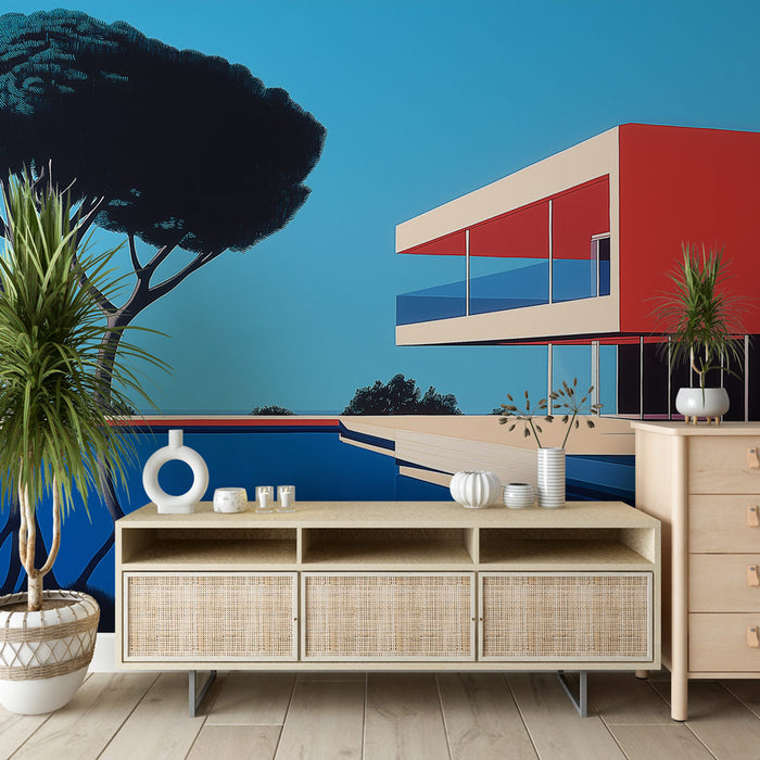 Une pièce moderne avec un papier peint graphique représentant une villa stylisée sur fond bleu vif, évoquant une ambiance estivale et contemporaine.