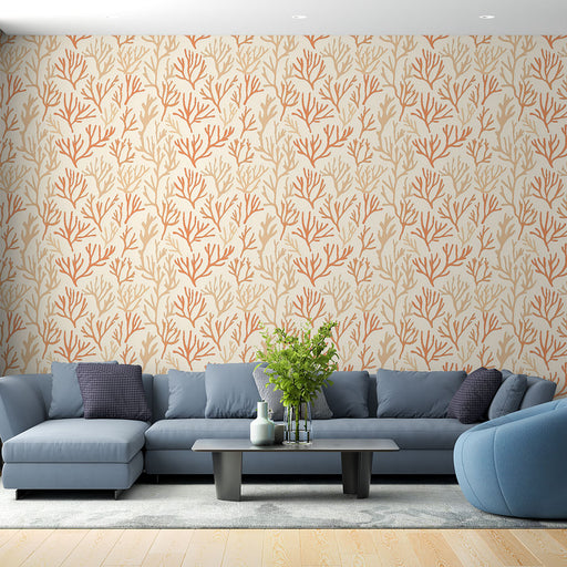 Un salon moderne avec un papier peint aux motifs de coraux orange sur fond beige, créant une ambiance chaleureuse et marine.