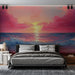 Une chambre moderne avec un papier peint représentant un coucher de soleil vibrant aux teintes roses et dorées, créant une atmosphère sereine et apaisante.