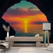 Papier peint coucher de soleil spectaculaire avec vue depuis une grotte pour salon moderne.