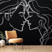 Papier peint minimaliste noir avec silhouettes entrelacées pour décoration murale moderne.