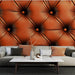 Papier peint cuir matelassé orange avec boutons décoratifs pour salon élégant