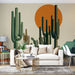 Un salon moderne avec un papier peint représentant des cactus stylisés sur fond beige, agrémenté d'un grand soleil orange, créant une ambiance chaleureuse et accueillante.