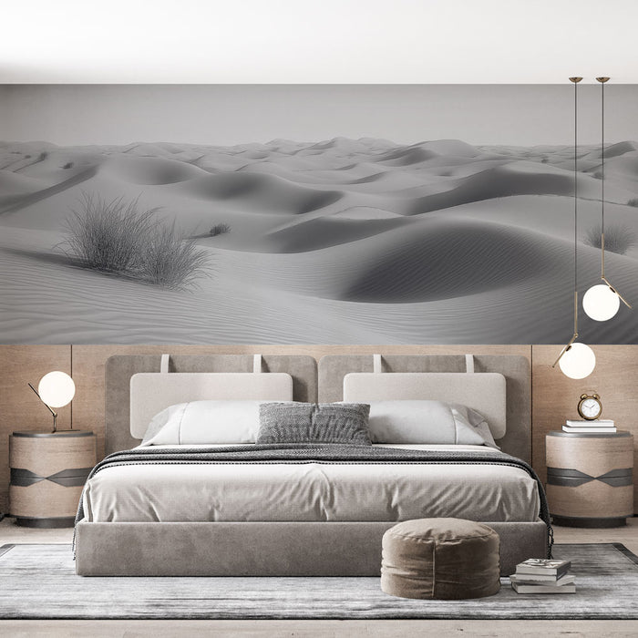 Une chambre moderne avec un papier peint représentant un paysage de dunes de sable en noir et blanc, créant une atmosphère apaisante et minimaliste.