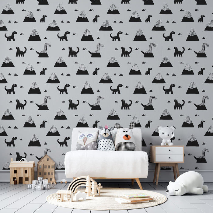 Une chambre d'enfant avec un papier peint ludique représentant des dinosaures et des montagnes en noir et blanc, créant une ambiance joyeuse et imaginative.