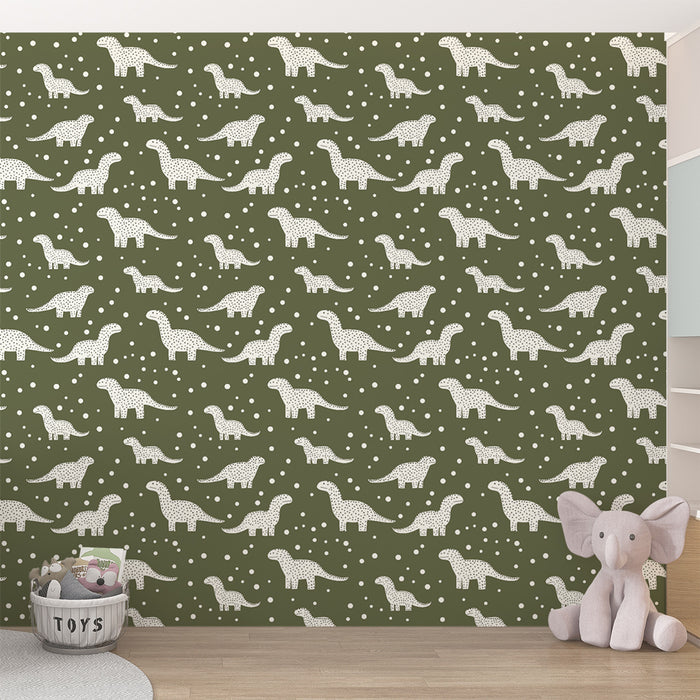 Une chambre d'enfant avec un papier peint vert olive illustrant des dinosaures blancs et des motifs de points, créant une ambiance ludique et joyeuse.
