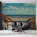 Papier peint paysage côtier avec dunes de sable et mer étincelante pour salon moderne.