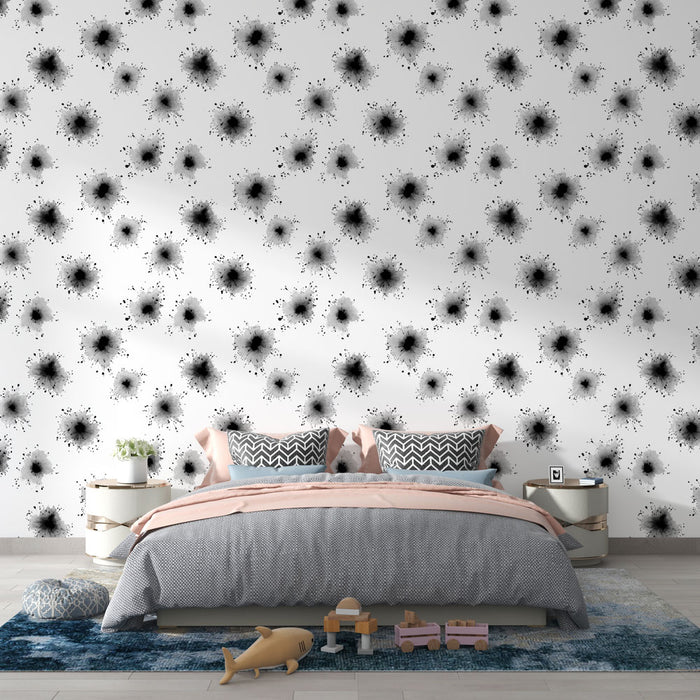 Une chambre moderne avec un papier peint abstrait noir et blanc, représentant des éclaboussures artistiques, créant une ambiance dynamique et contemporaine.