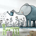 Une chambre d'enfant avec un papier peint illustratif représentant un éléphant arrosant des fleurs, créant une ambiance ludique et douce.